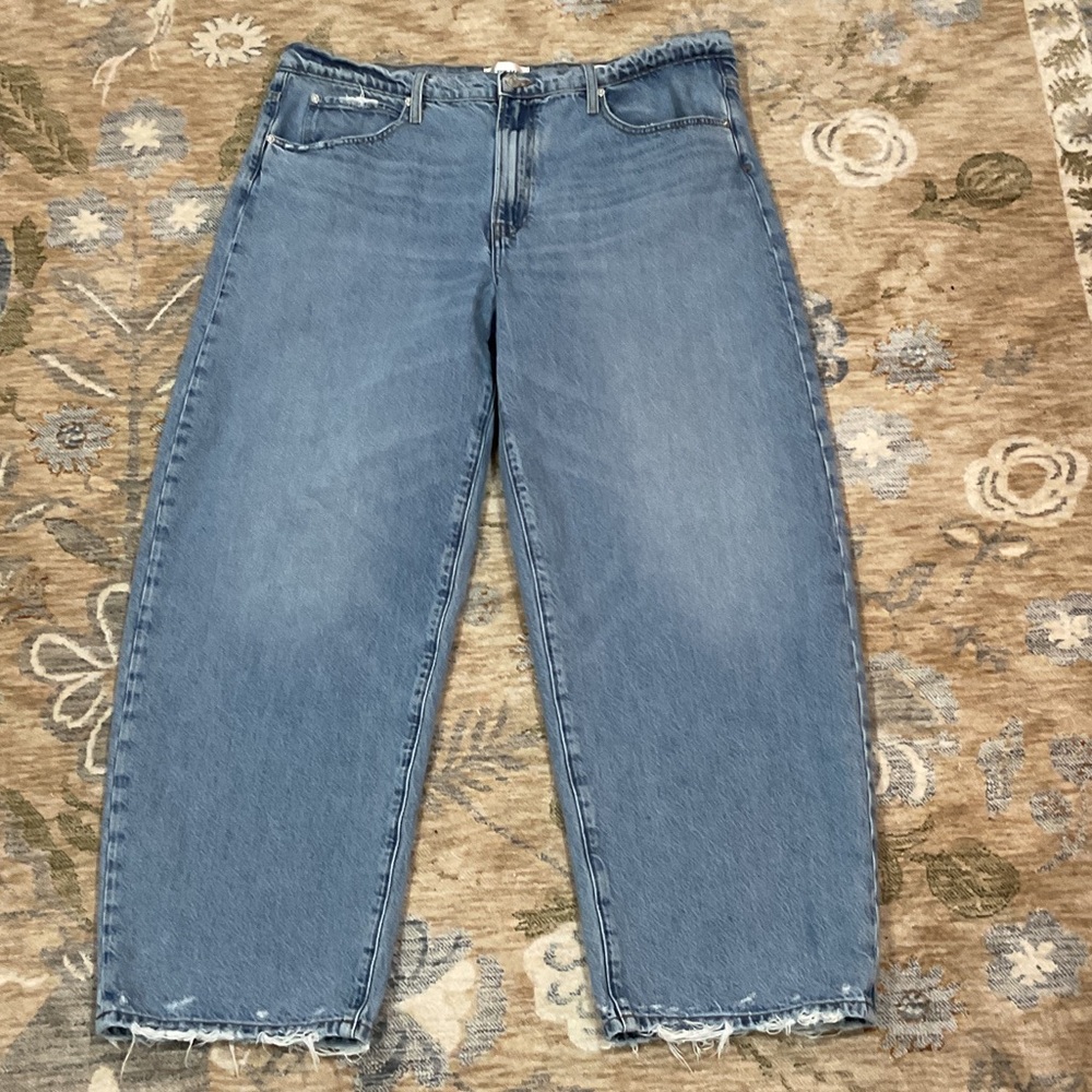 Frame low slung barrel distressed hem jeans